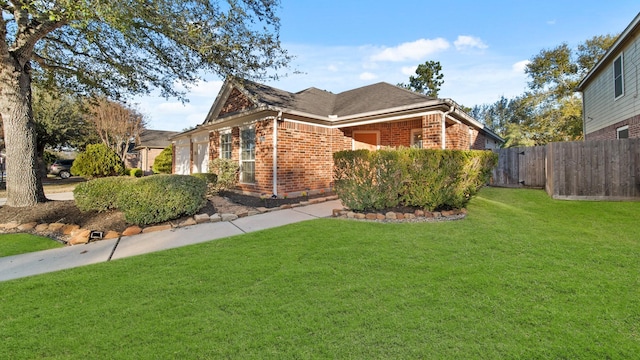 view of side of home with a yard