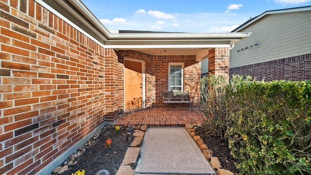 entrance to property featuring a patio area