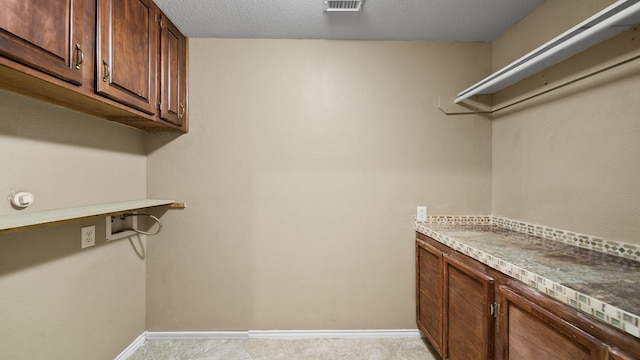 walk in closet featuring built in desk