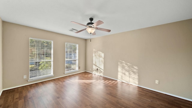 spare room with ceiling fan and hardwood / wood-style floors