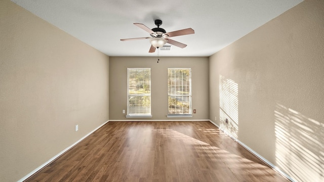 unfurnished room featuring ceiling fan and wood-type flooring