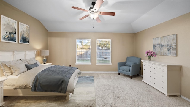 carpeted bedroom featuring vaulted ceiling and ceiling fan