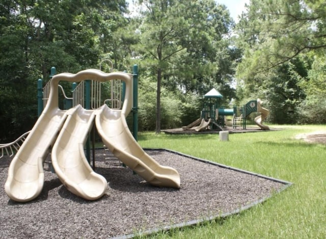 view of jungle gym with a lawn