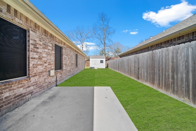 view of yard featuring a shed and a patio