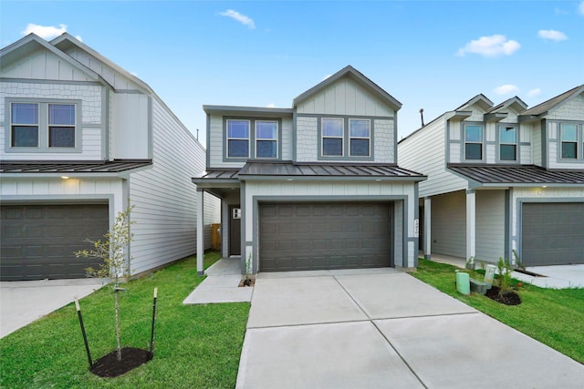 view of front of property with a front lawn and a garage