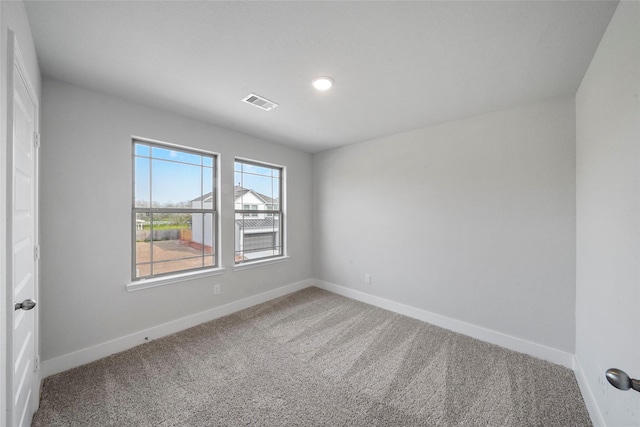 unfurnished room with carpet floors