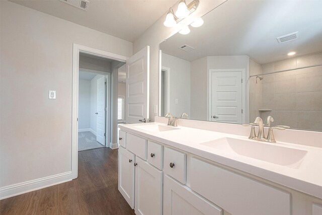 bathroom with hardwood / wood-style floors and vanity