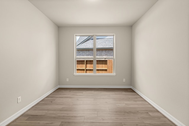 spare room featuring light wood-type flooring