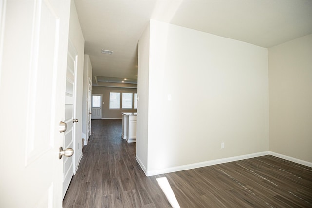 hallway featuring dark hardwood / wood-style flooring