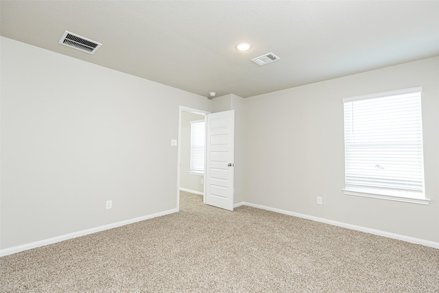 view of carpeted spare room