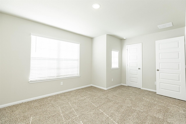 unfurnished room featuring carpet floors