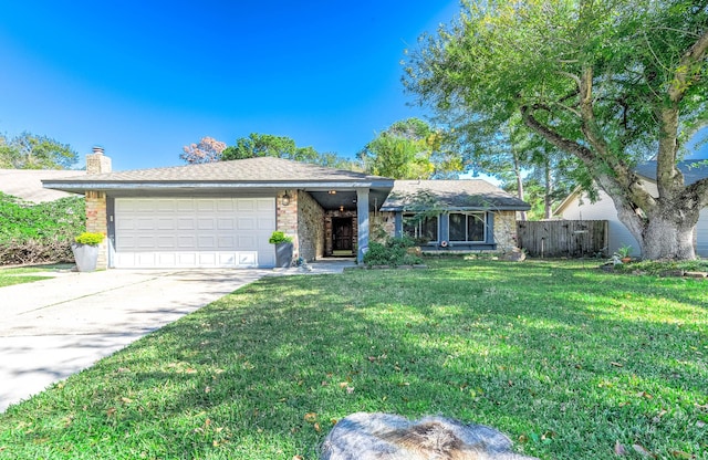 ranch-style home with a garage and a front yard