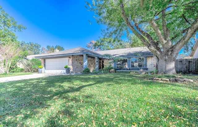 ranch-style home with a garage and a front yard