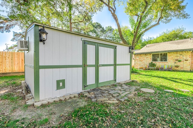 view of outdoor structure with a lawn