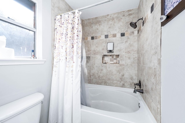 bathroom with toilet and shower / bathtub combination with curtain