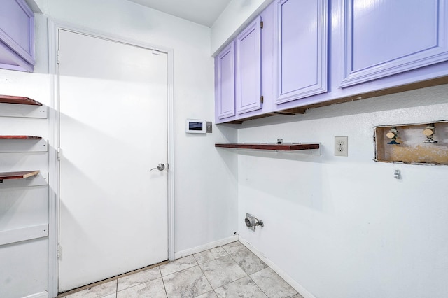 washroom with cabinets and light tile patterned floors