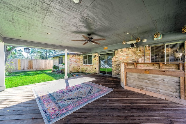 wooden terrace featuring ceiling fan