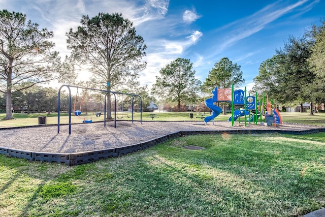 view of jungle gym featuring a lawn