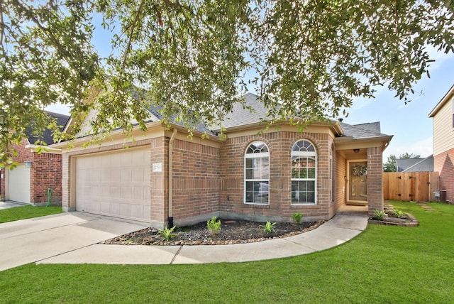 single story home featuring a garage and a front lawn