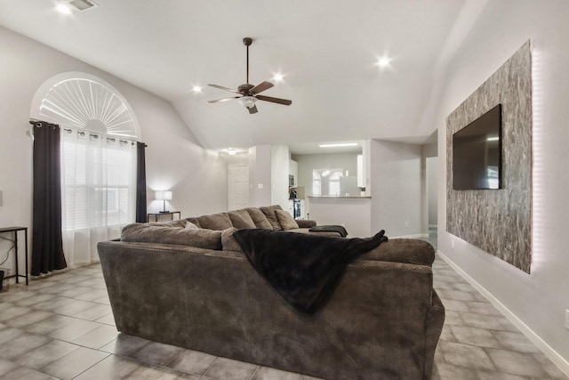 living room featuring ceiling fan and lofted ceiling