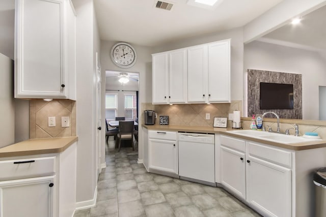 kitchen featuring white cabinets, dishwasher, backsplash, and sink