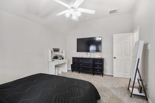 carpeted bedroom with ceiling fan and lofted ceiling