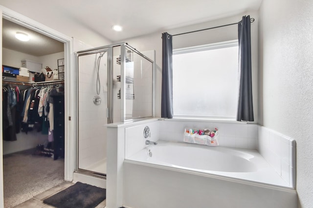 bathroom with independent shower and bath