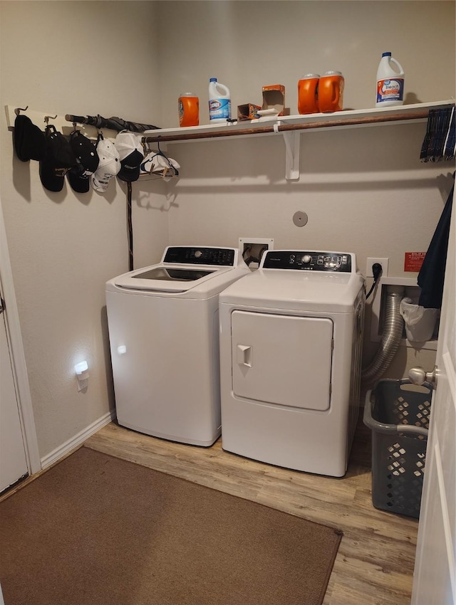 washroom featuring washer and dryer and light wood-type flooring