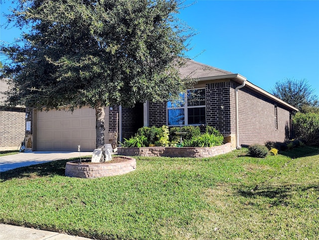 view of front of house with a front yard and a garage