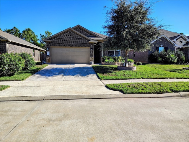 view of front of property with a front lawn and a garage