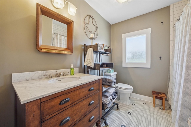 bathroom featuring tile patterned floors, vanity, a shower with shower curtain, and toilet