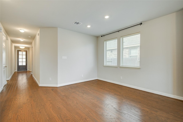 unfurnished room featuring hardwood / wood-style flooring and plenty of natural light