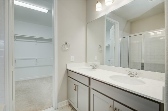 bathroom with vanity and walk in shower