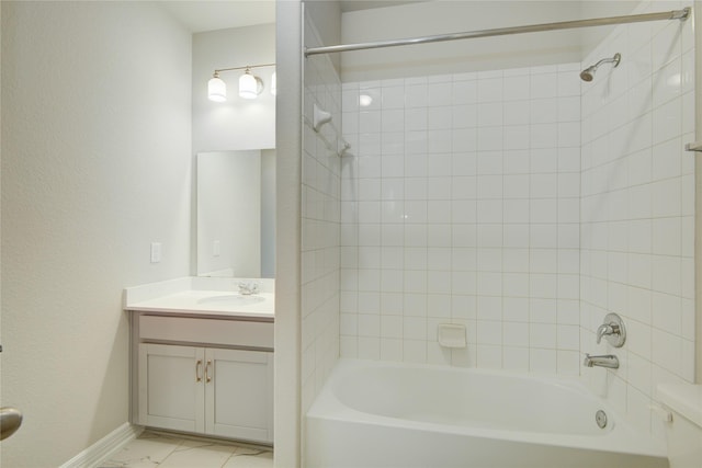 bathroom with vanity and tiled shower / bath combo