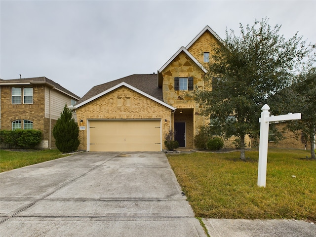 view of front facade with a front yard and a garage