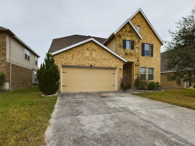 view of front of house with a garage and a front yard