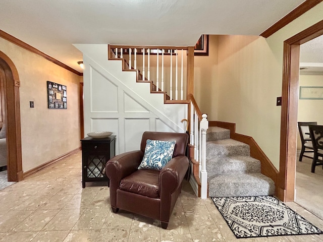 staircase with crown molding