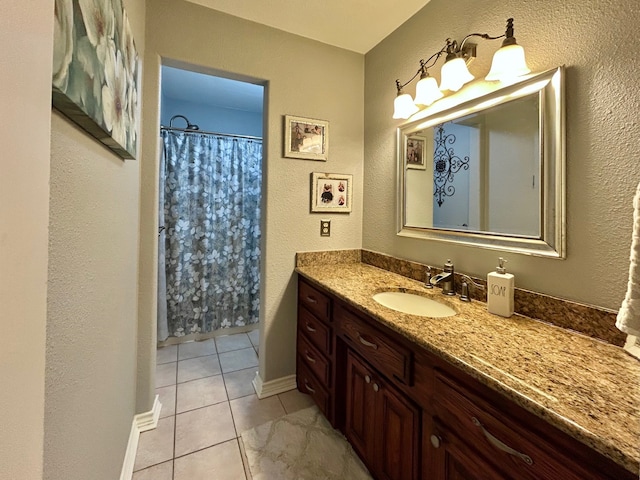 bathroom featuring tile patterned floors, vanity, and a shower with curtain