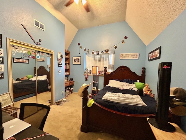 carpeted bedroom featuring a textured ceiling, a closet, ceiling fan, and lofted ceiling