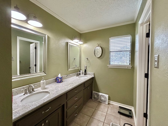 bathroom with tile patterned floors, vanity, a textured ceiling, and ornamental molding