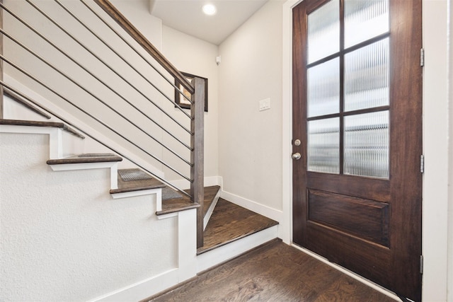 foyer entrance featuring dark hardwood / wood-style flooring