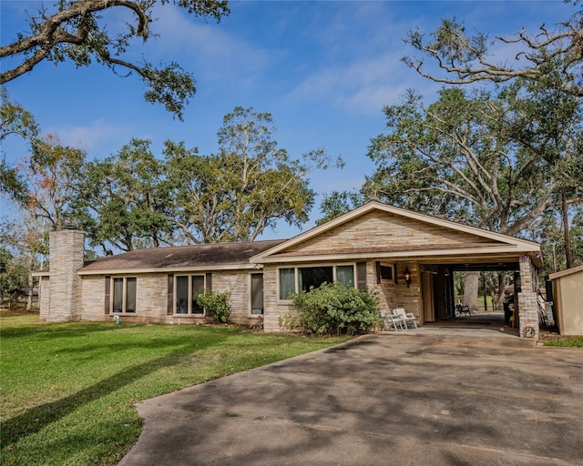 single story home featuring a front lawn and a carport