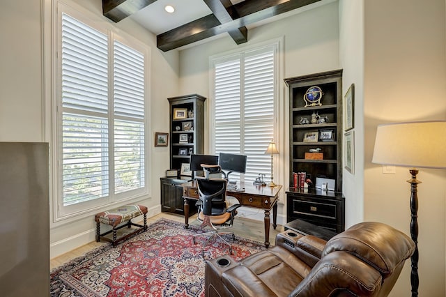 home office featuring hardwood / wood-style floors, beam ceiling, and coffered ceiling