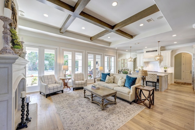 living room with beamed ceiling, french doors, light hardwood / wood-style flooring, and coffered ceiling