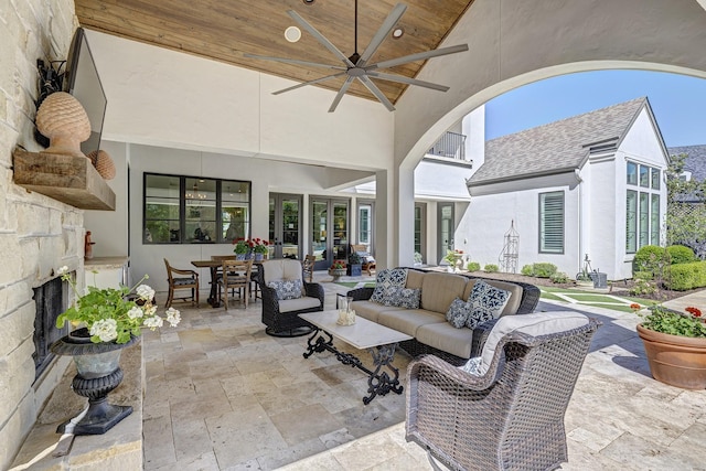 view of patio / terrace featuring ceiling fan and an outdoor living space