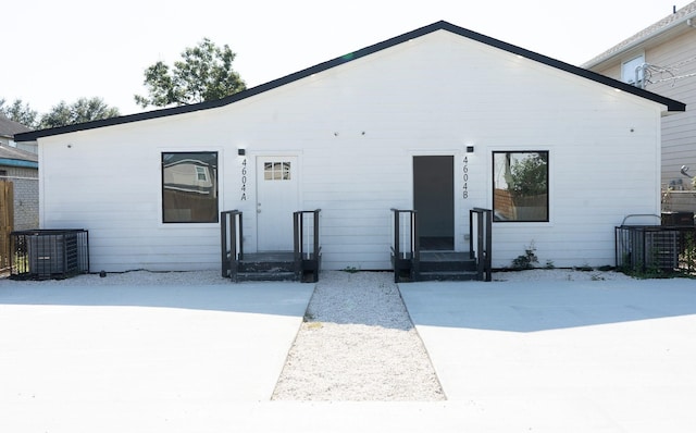 rear view of house with central AC unit