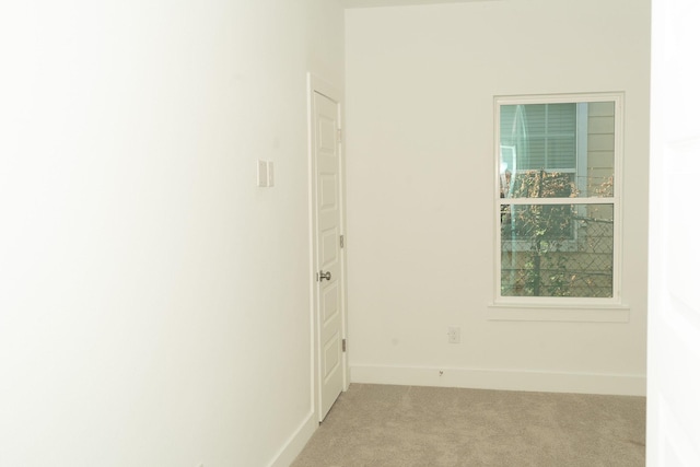 hallway with light carpet