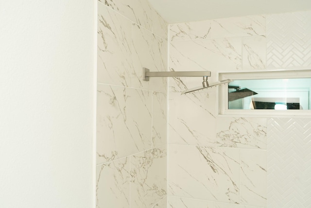 interior details with a tile shower