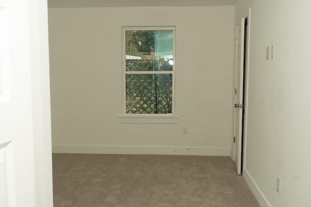 empty room with light colored carpet