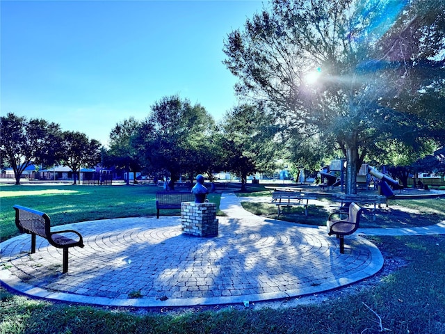 view of community with a playground and a yard